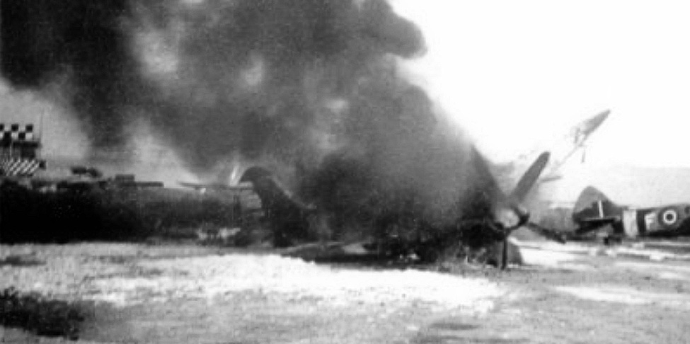 RAF Spitfire in flames after attack by Egyptian air force on Ramit David airfileld, Israel 22 May 1948